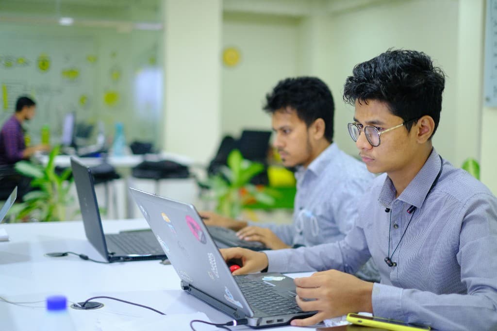 Developer building digital platform software in a modern office